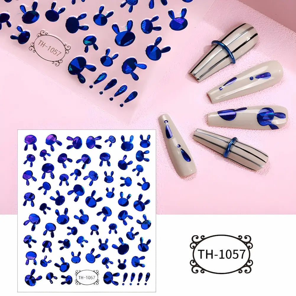 Adesivos para unhas com desenhos de rostos e orelhas de coelho em azul metálico. Código: TH-1057.