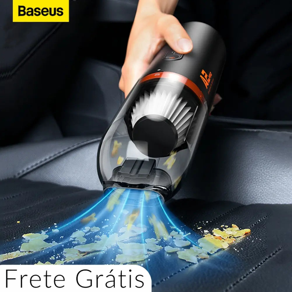 A imagem mostra uma pessoa usando um aspirador de pó portátil Baseus para limpar migalhas em um banco de carro. O aspirador é preto com detalhes laranja e está sugando sujeira, visível pela corrente de ar azul. No canto superior esquerdo, há um logotipo da Baseus. No canto inferior direito, há um texto indicando "Frete Grátis".