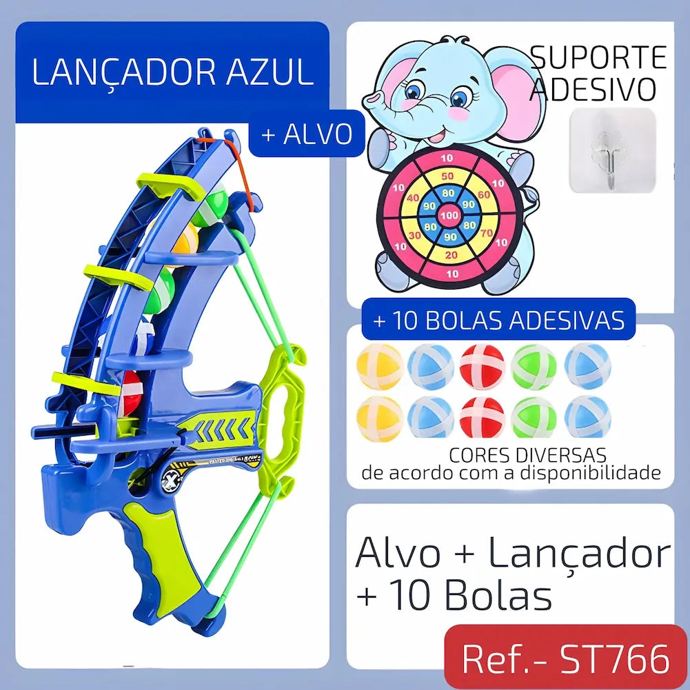 Ref. ST766 Imagem de um alvo de elefante de 46,5 cm por 34 cm com círculos de pontuação coloridos, acompanhado de três bolas (azul, rosa, verde) de 3,5 cm de diâmetro e um suporte adesivo.