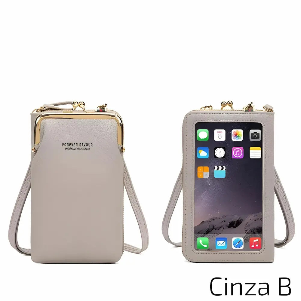 Uma bolsa de couro cinza com alça ajustável. Inclui uma janela frontal transparente para o celular e um fecho metálico no topo. No canto inferior direito, o código "Cinza B", uma das opções de compra.