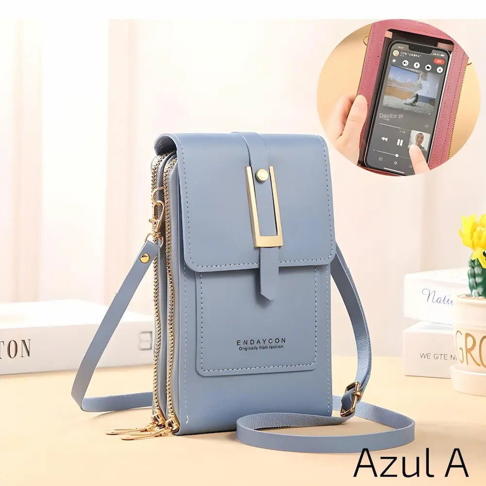 Esta bolsa de couro azul clara possui uma alça ajustável e fecho metálico dourado. Tem dois zíperes laterais e um bolso frontal com o nome da marca "ENDAYCON". No canto inferior direito, o código "Azul A", uma das opções de compra.