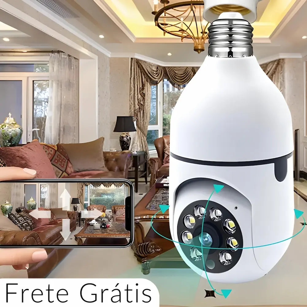 A imagem mostra uma câmera de segurança em forma de lâmpada instalada no teto de uma sala de estar luxuosa. Um smartphone na imagem exibe a visualização ao vivo da câmera, destacando a capacidade de monitoramento remoto. No canto inferior esquerdo, há o texto "Frete Grátis". A câmera possui luzes LED ao redor da lente para visão noturna.