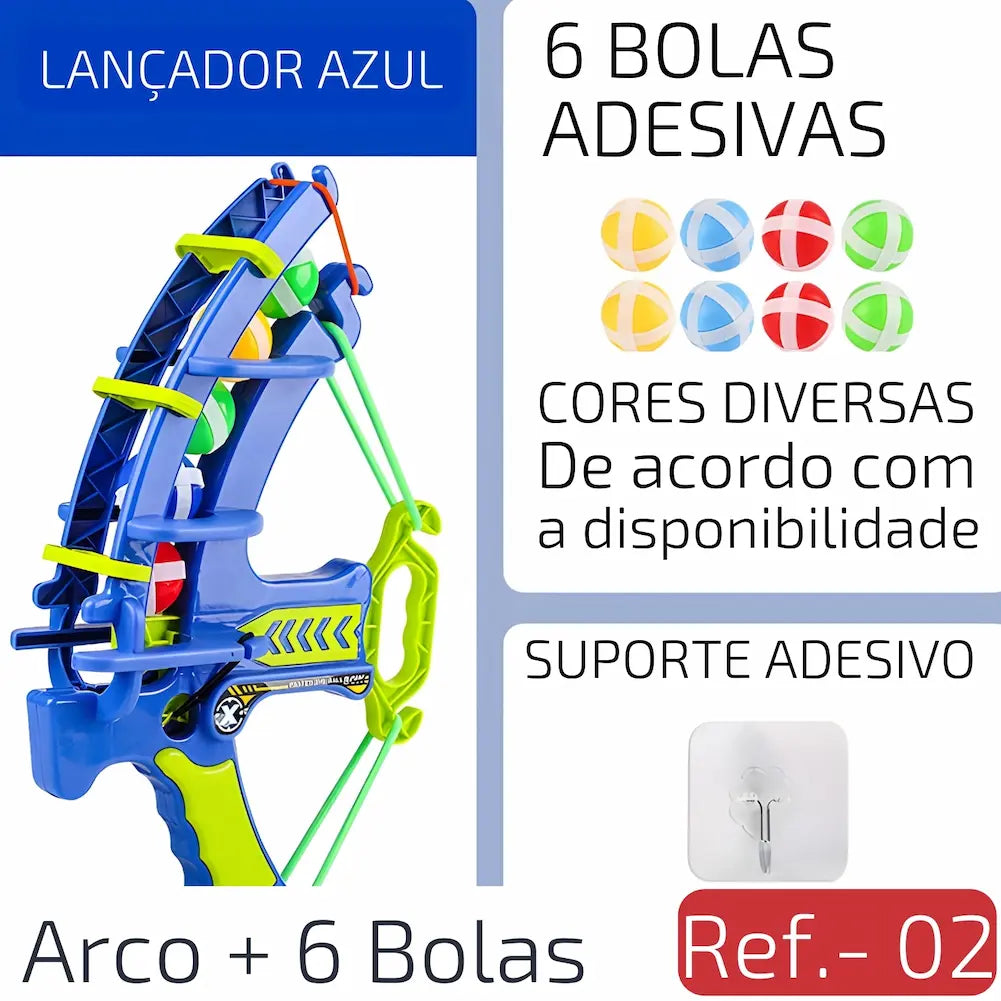 Ref. 02 Imagem mostrando um lançador azul com alça verde, acompanhado de seis bolas adesivas coloridas e um suporte adesivo para fixação.