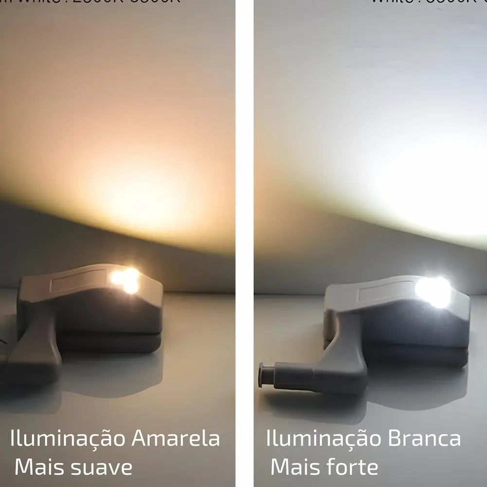 A imagem compara dois tipos de iluminação LED para armários. À esquerda, uma luz LED amarela suave, com a descrição "Iluminação Amarela Mais suave". À direita, uma luz LED branca intensa, com a descrição "Iluminação Branca Mais forte". Ambas as luzes são mostradas em peças cinza semelhantes, destacando a diferença na intensidade e cor da iluminação.