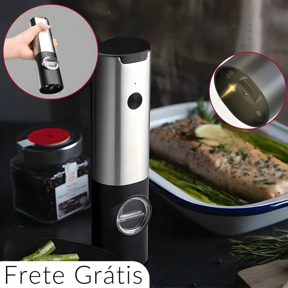  A imagem mostra um moedor de pimenta elétrico em aço inoxidável sobre uma mesa, ao lado de um prato com peixe assado e aspargos. Dois círculos ampliados destacam a luz LED na base do moedor e uma mão segurando o moedor. Na parte inferior esquerda, há o texto "Frete Grátis".