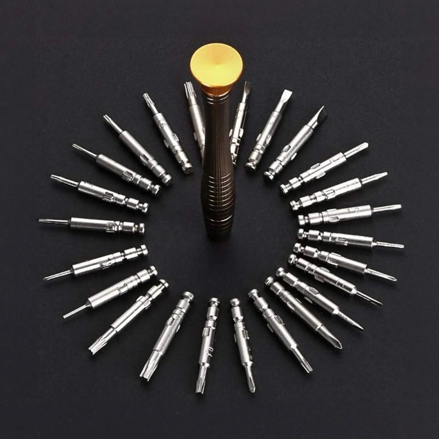 A imagem mostra um conjunto de bits de precisão organizados em formato circular ao redor de uma chave de fenda. Os bits são de vários tamanhos e formatos, adequados para trabalhos detalhados e precisos, como reparos em eletrônicos, relógios ou outros itens que exigem ferramentas pequenas e especializadas.