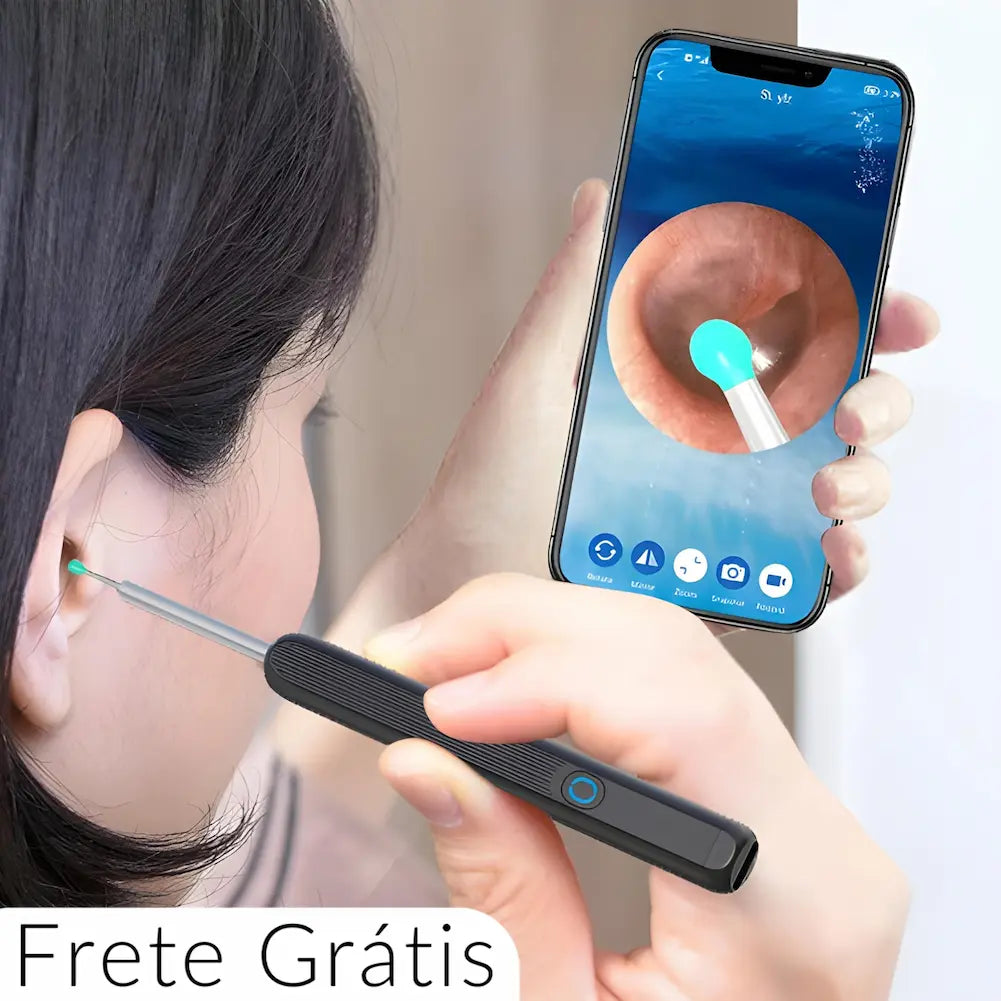 A imagem mostra um limpador de ouvidos com câmera integrada, transmitindo imagens ao vivo para um smartphone. O dispositivo é portátil, possui luz na ponta para melhor visualização e é usado para examinar o canal auditivo. O texto "Frete Grátis" sugere uma promoção associada ao produto.