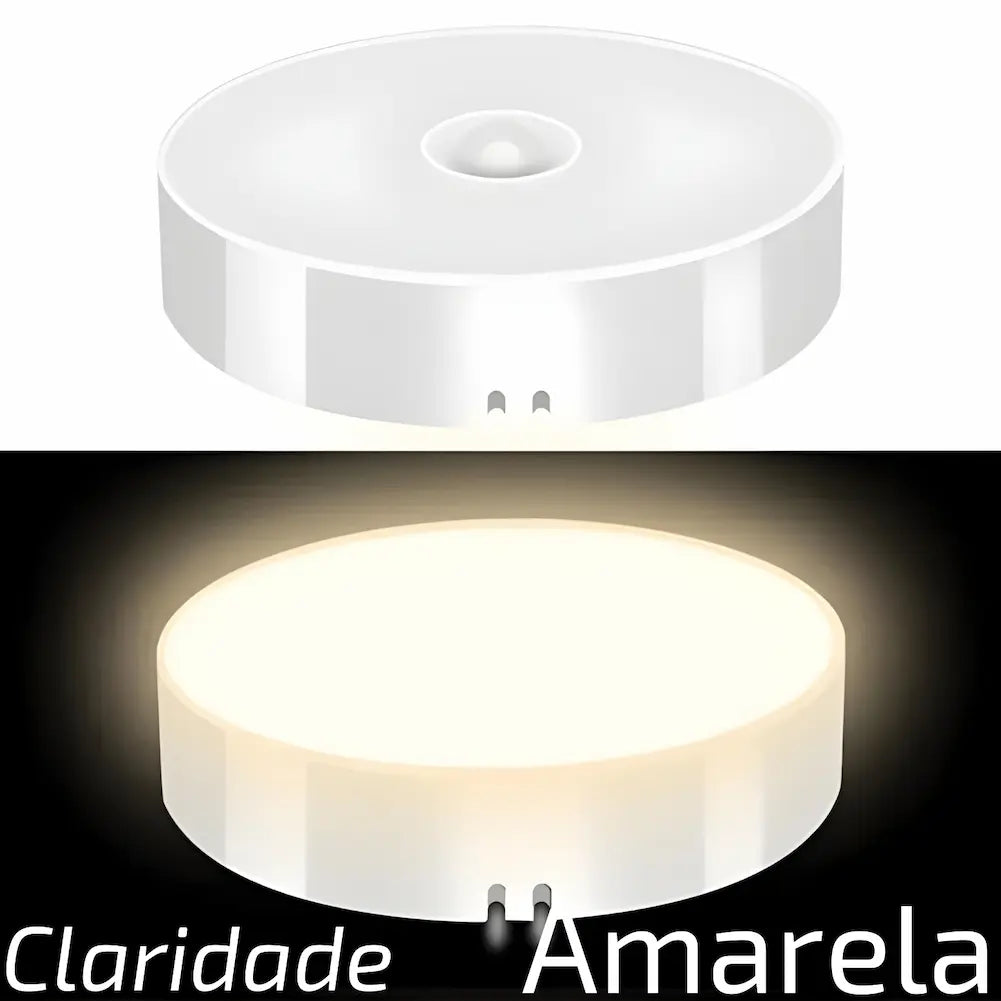  Duas imagens de uma luminária redonda. Na parte superior, a luminária está apagada. Na parte inferior, a luminária está acesa, emitindo uma luz amarela. Texto na parte inferior diz "Claridade Amarela".