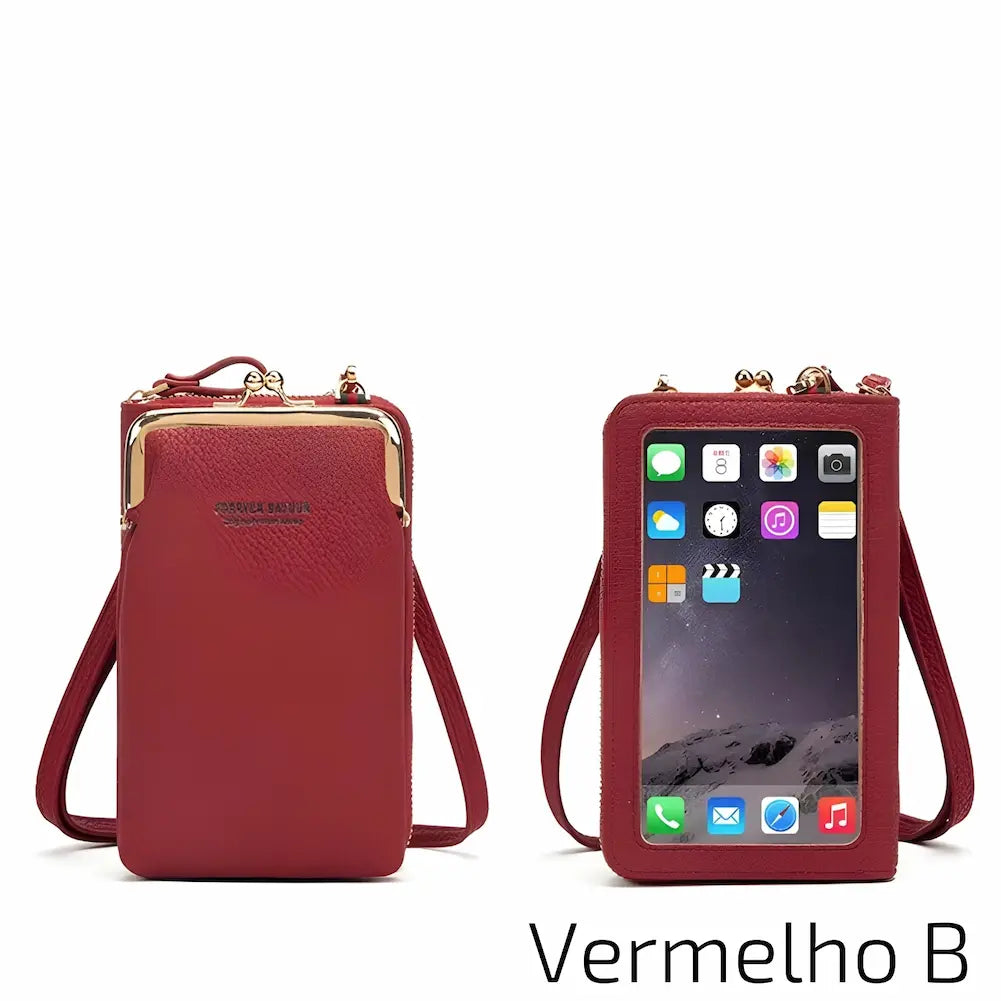 Esta bolsa de couro vermelho tem uma alça ajustável e uma janela frontal transparente para o celular. O fecho metálico no topo adiciona segurança. No canto inferior direito, o código "Vermelho B", uma das opções de compra.
