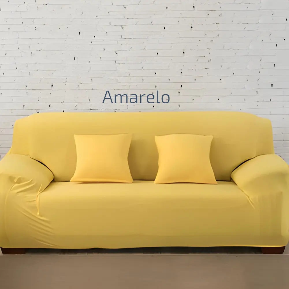 Imagem de um sofá amarelo com três almofadas amarelas combinando, contra uma parede branca de tijolos expostos. Texto central: "Amarelo". O sofá está em um piso cinza claro.